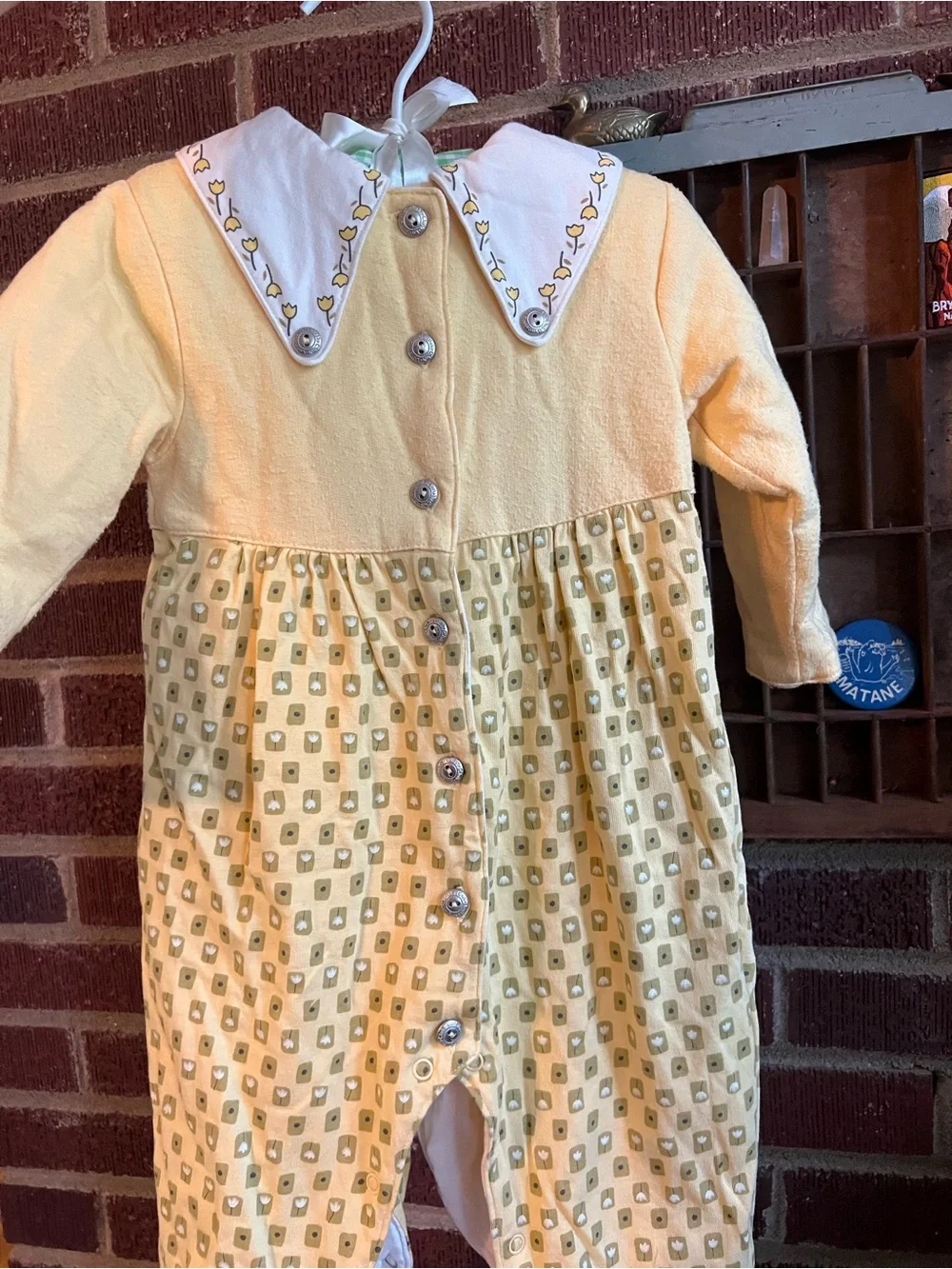 Lullaby Club Yellow Tulip Collar Baby onesie. Double layered